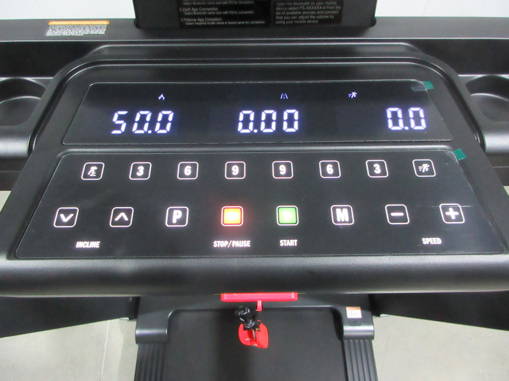 Endurance SPT treadmill control panel with digital display showing speed, distance, and incline settings.